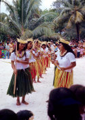 Wilcommen, No. 0038 Young Carolinian Women Performing a Traditional Stick Dance While an Onlooker Takes Photos